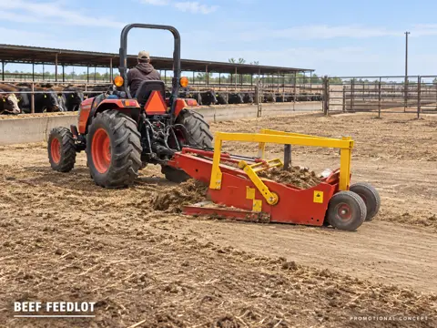 Tractor-towed red scraper cleans feedlot — application concept
